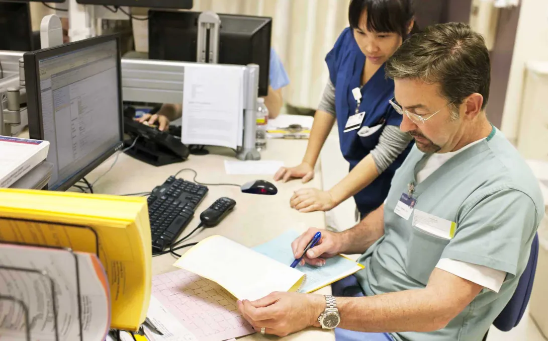 Nurse and doctor at computer