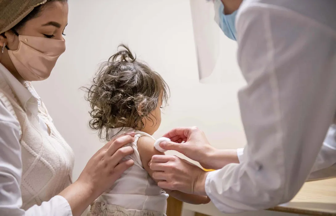 Toddler receiving a vaccine