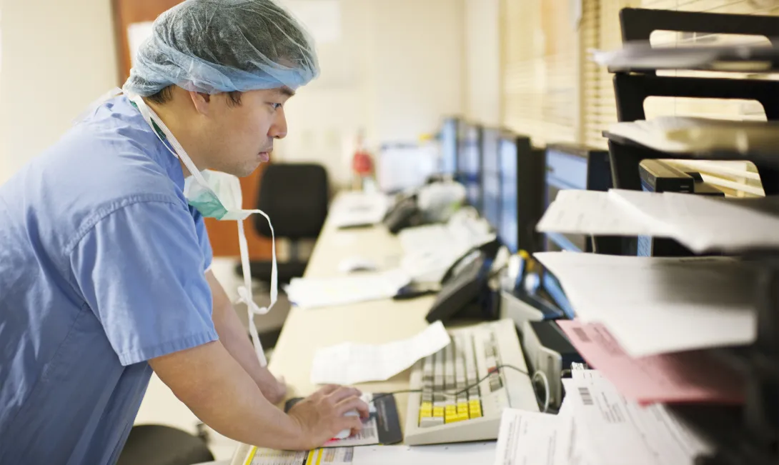 Clinician in front of computer