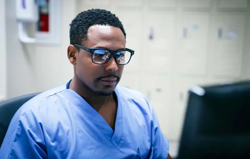Clinician at computer