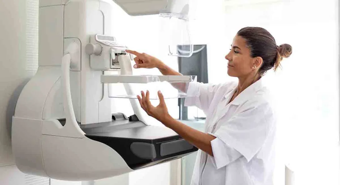 Clinician preparing mammography machine