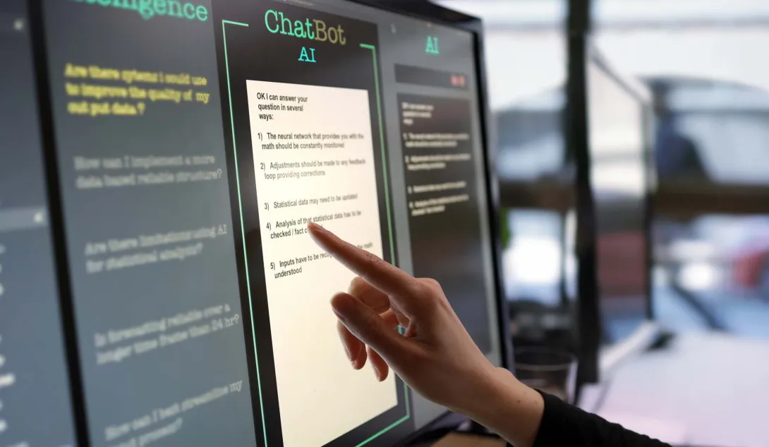Finger at touchscreen labeled ChatBot AI