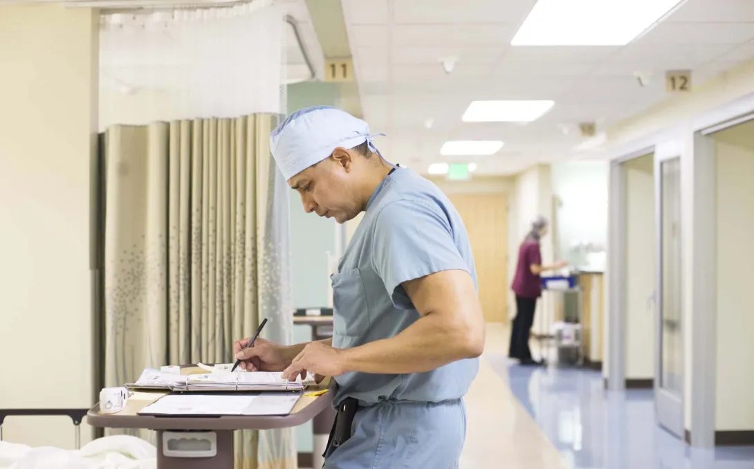 Doctor at desk in hallway