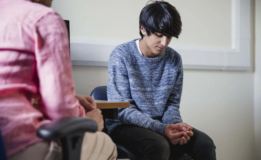 Two seated people meeting