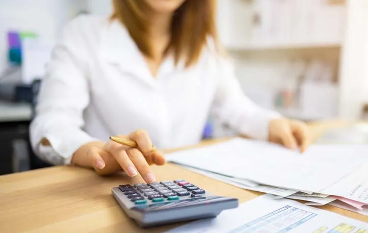 Employee using calculator