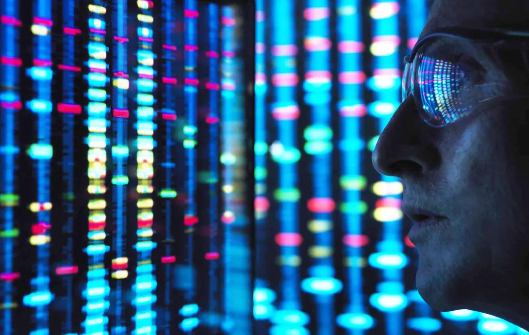 Scientist looking at DNA on a screen