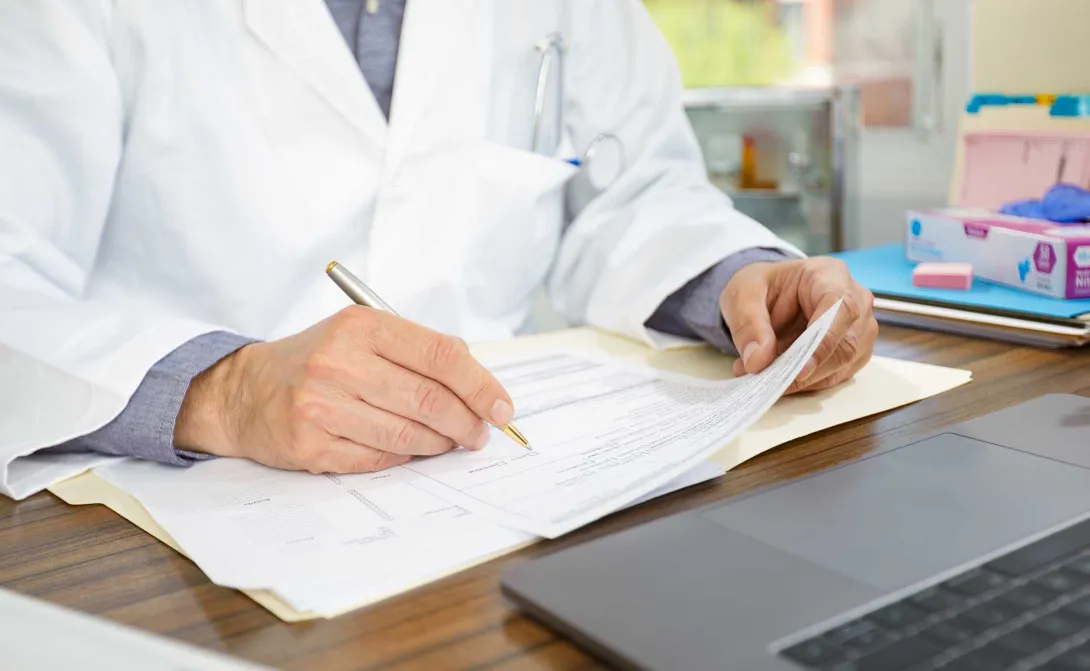 Doctor filling out form