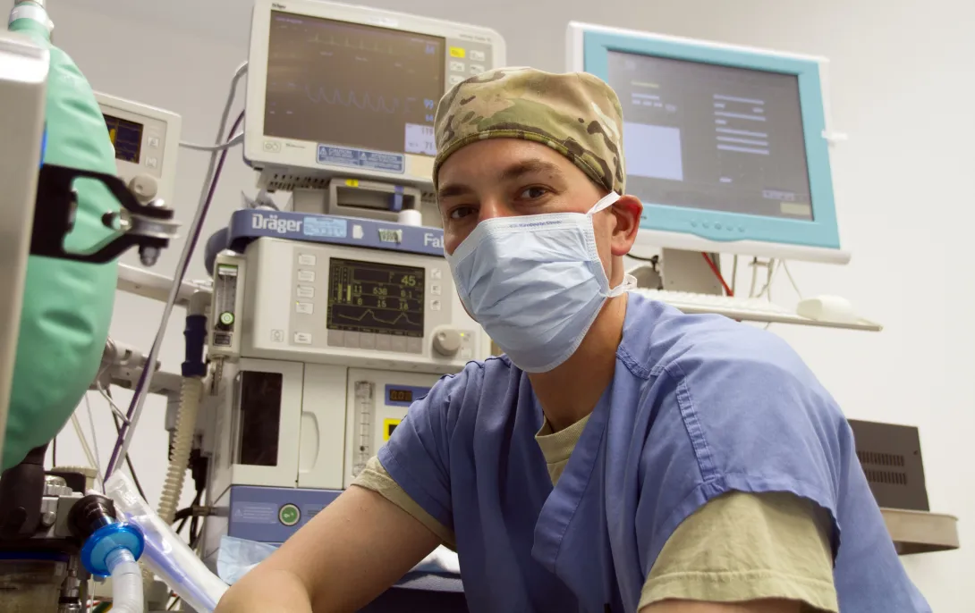 Healthcare professional with computers and screens