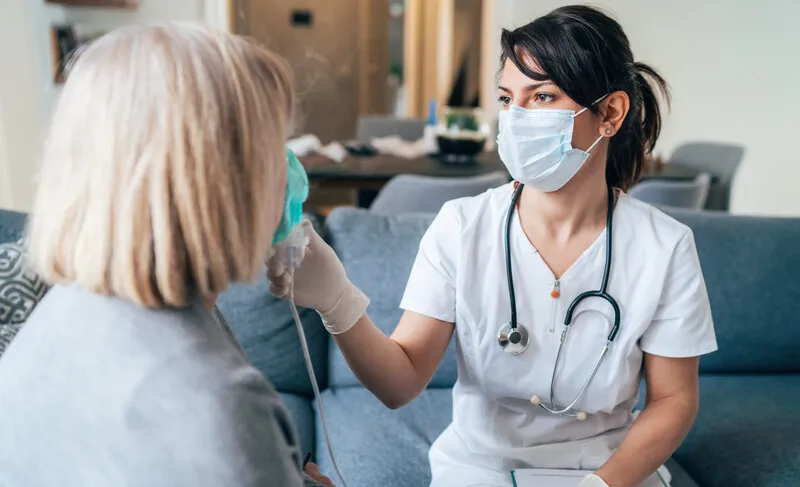 Nurse with patient in the home