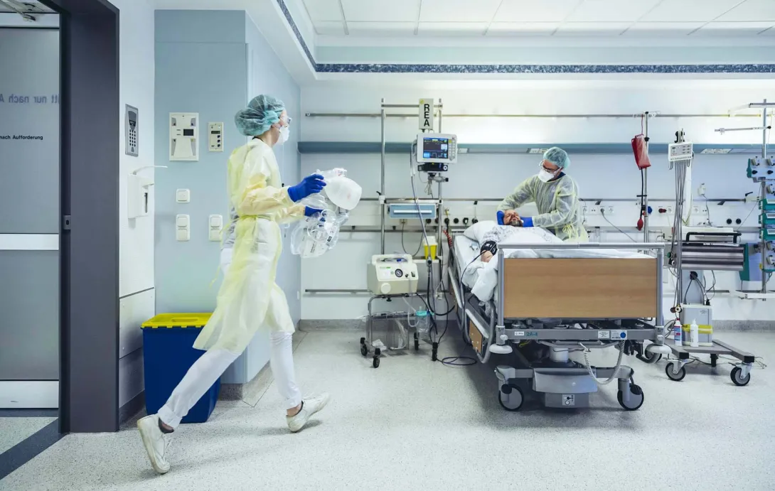 Hospital room with patient and caregiver