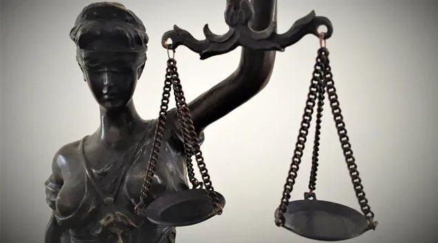 Miss Justice statue with scales