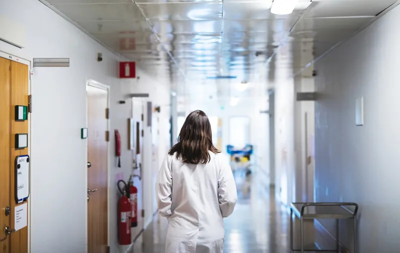Nurse walking down corridor