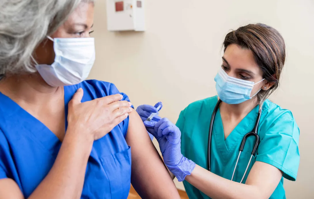 Healthcare professional administering vaccine
