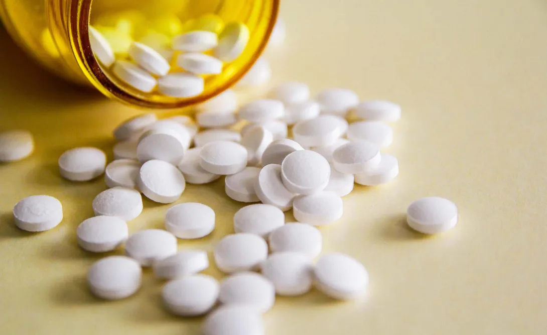Pills spilling out of bottle