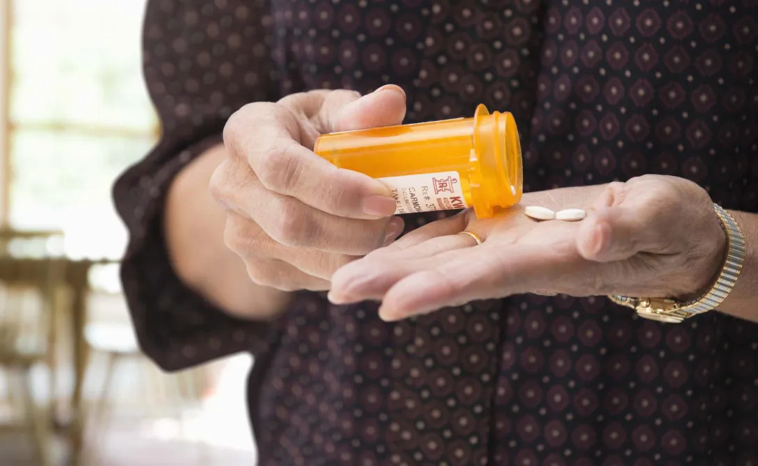 Hands with prescription bottle