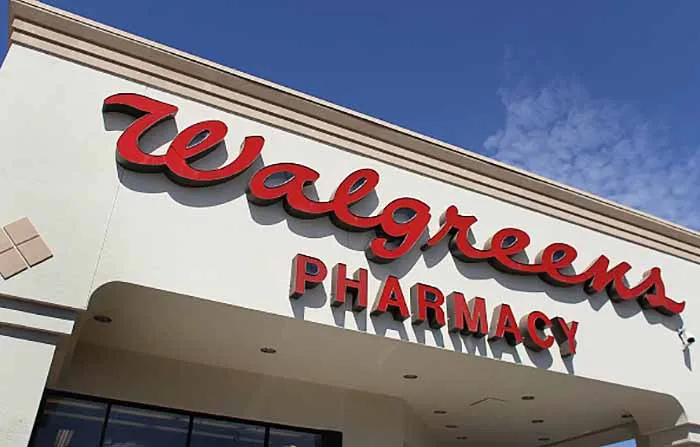 A Walgreens pharmacy sign over entrance