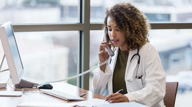 A medical professional on the phone