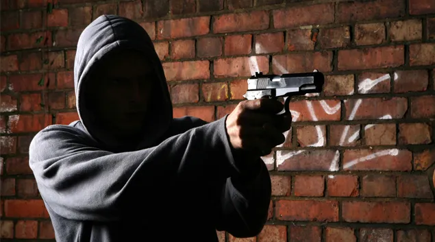 Person pointing a gun