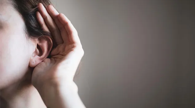 Person cupping an ear