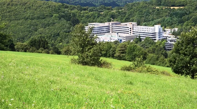 A rural hospital nestled in green hills