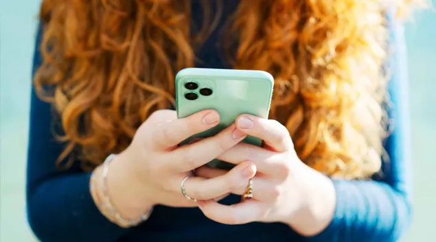 Person holds smartphone